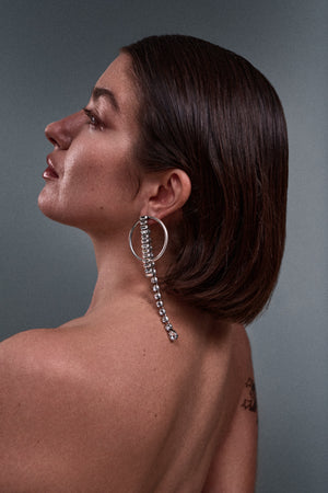 model wearing ANEIDA Jewelry pendant earrings made in silver plated brass with Swarovski clear crystals