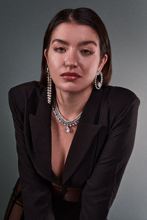 Model wearing ANEIDA jewelries in silver plated brass with Swarovski clear crystals