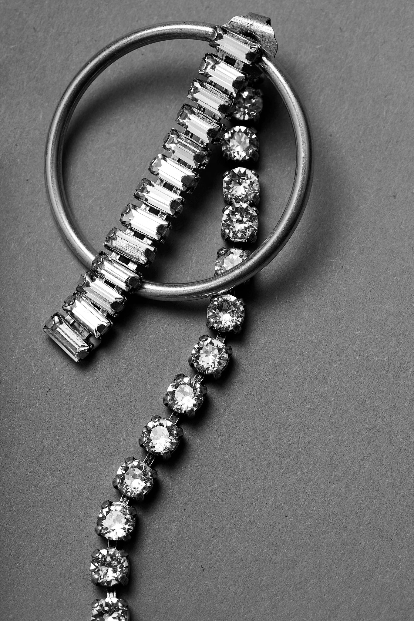 close up of pendant earring by ANEIDA Jewelry made in silver plated brass with Swarovski clear crystals