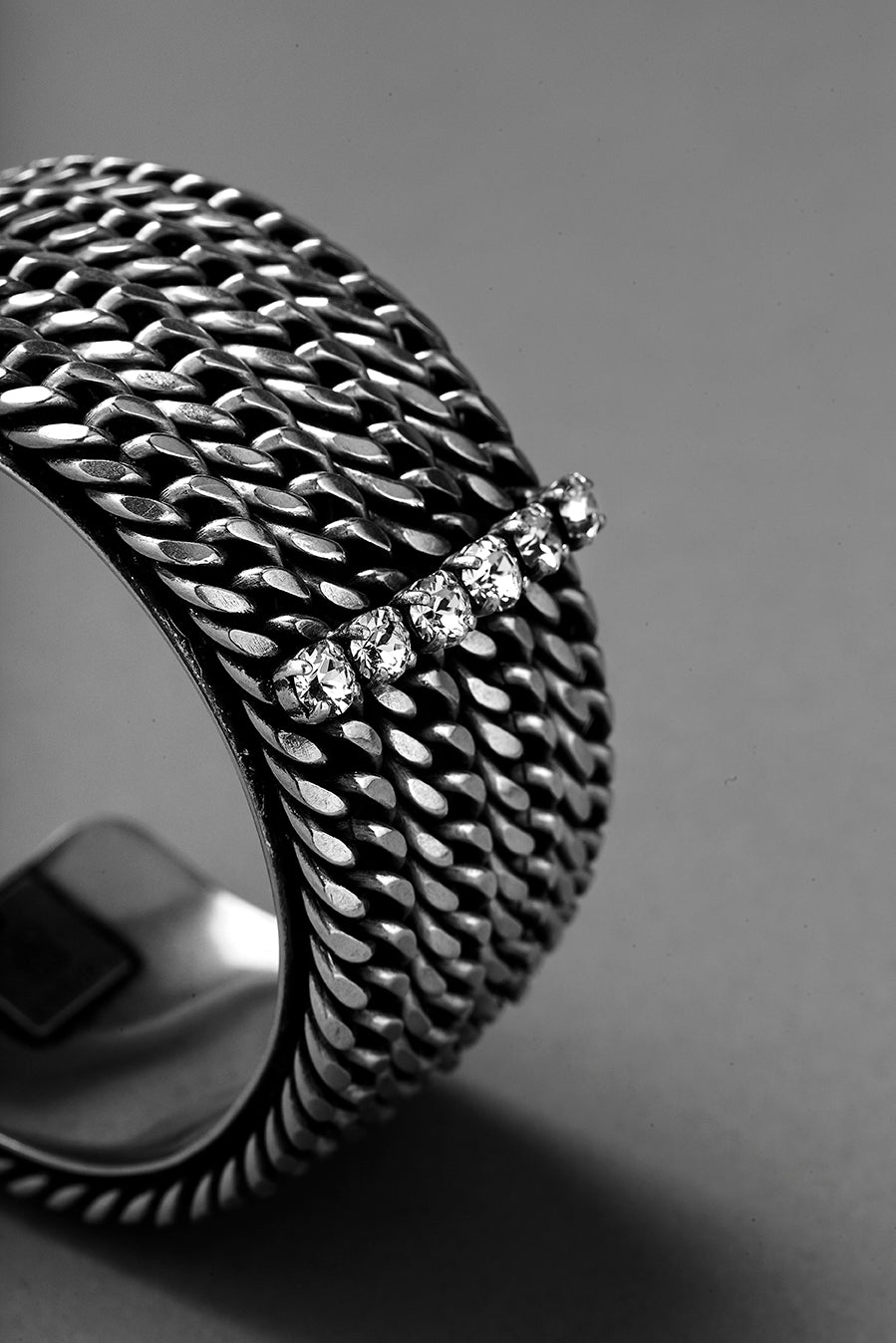 details of a cuff bracelet made by ANEIDA jewelry in silver plated brass and Swarovski clear crystals